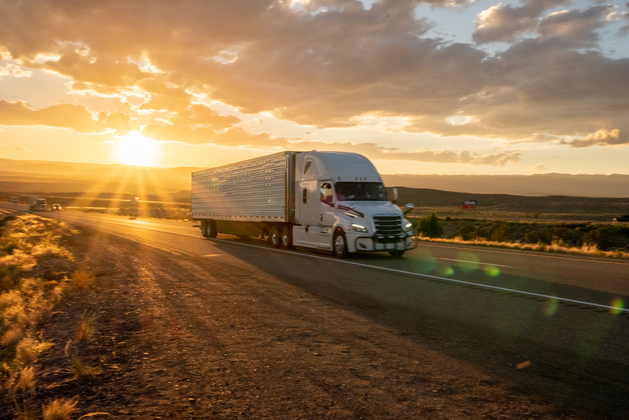 Truck on Highway at Sunrise